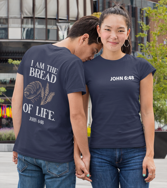 Two people wearing navy blue t-shirts with text, standing outdoors.